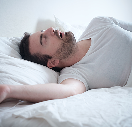 A man sleeping with his mouth open.
